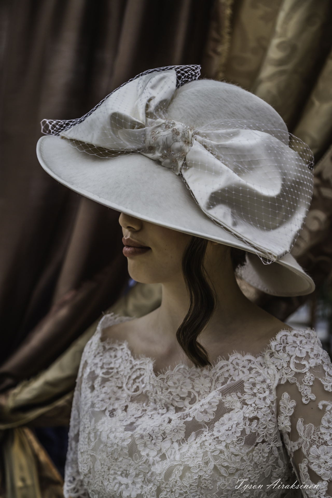 white hat with veil and large bow by Lynda Marie