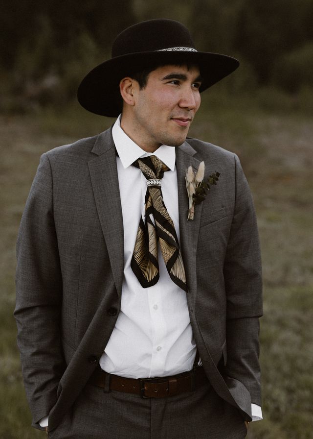 Indigenous Groom with foxtail boutonniere and hat 