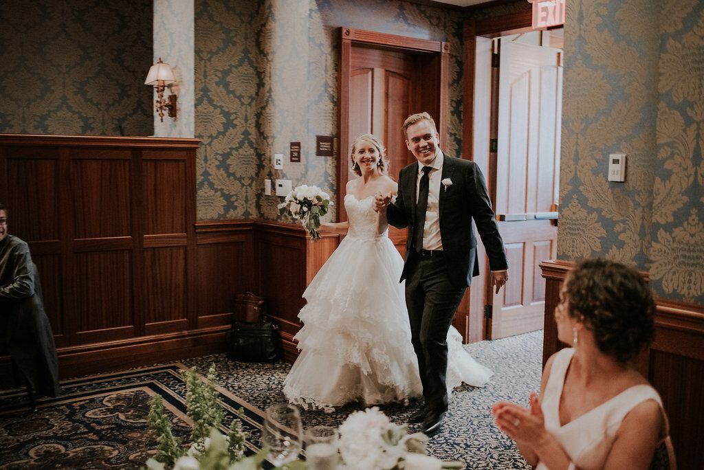 Newlyweds enter Oak Bay Beach Hotel reception on Vancouver Island