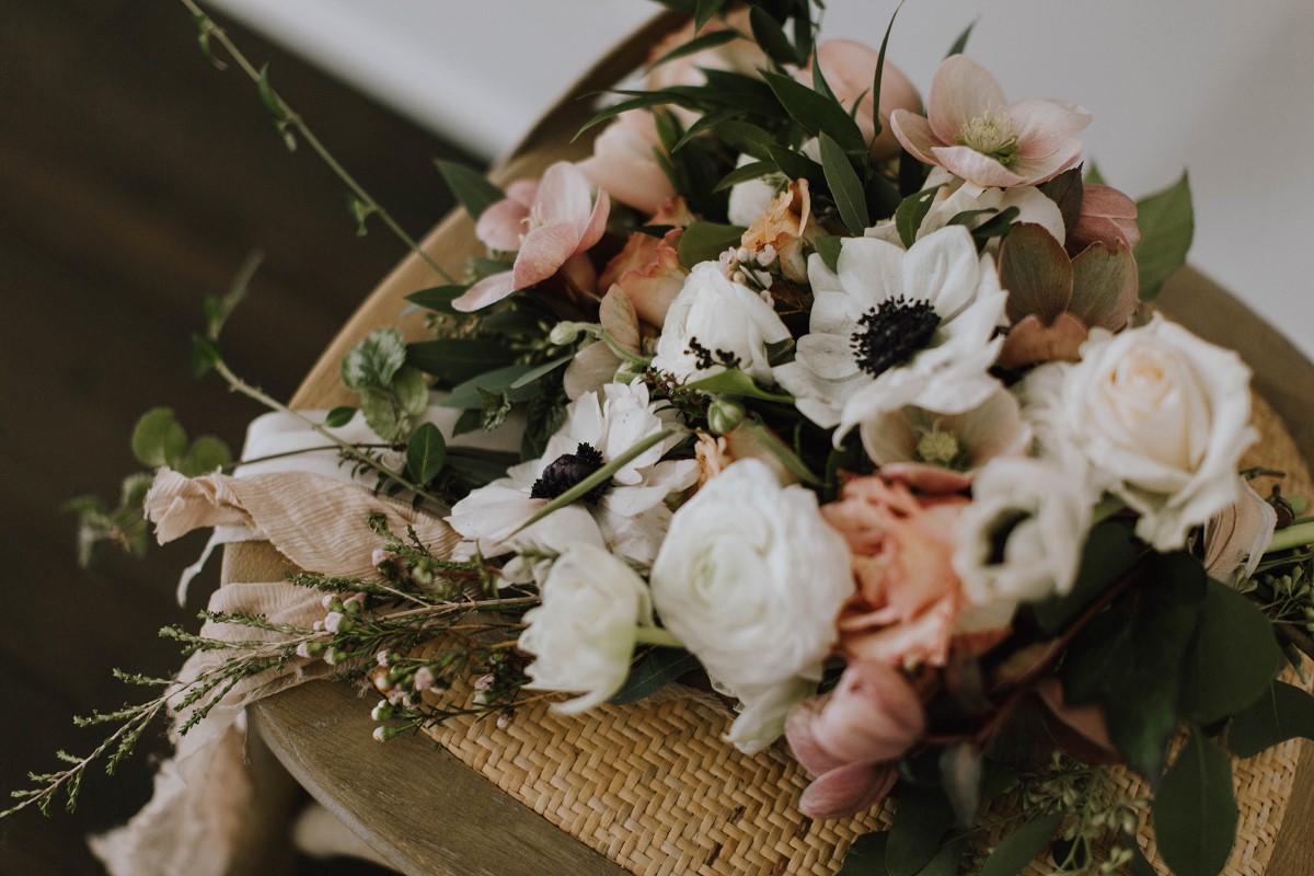 Sophisticated Wedding Bouquet of anemones and peach roses Myrtle and Moss Photography