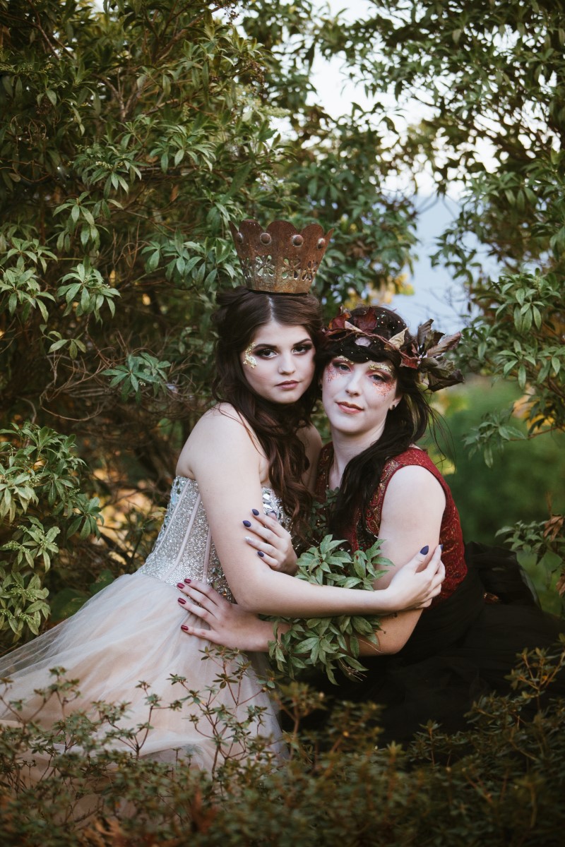 Two brides in royal styled gowns