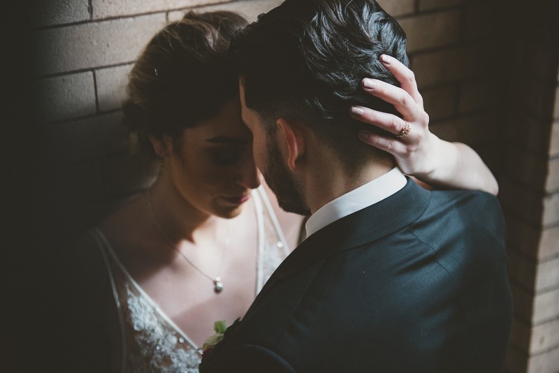 Bride and groom in stairwell at Fiarmont Empress Vancouver Island