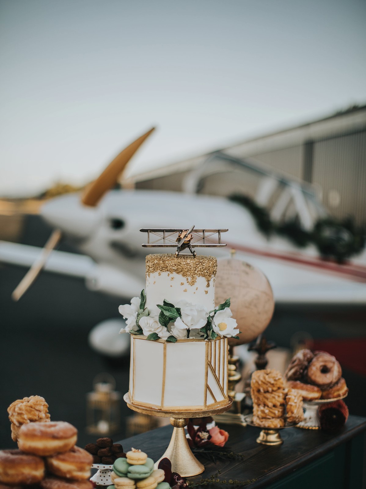 White and Gold Cake with airplane topper by Passion for Cakes