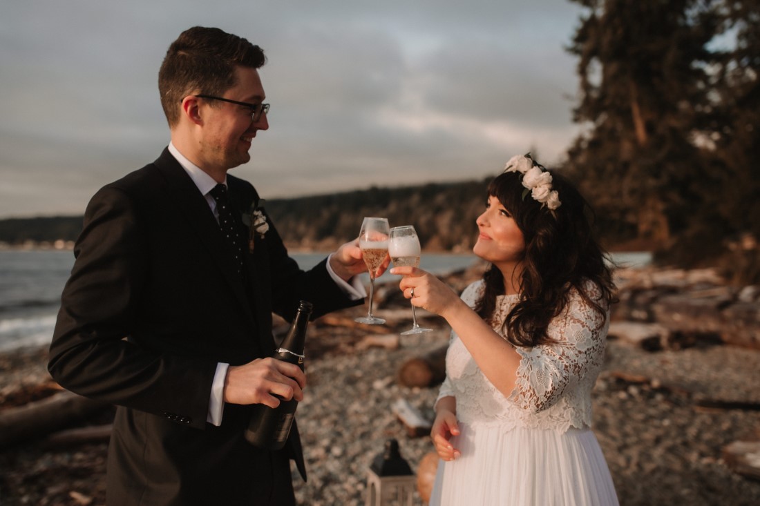 Sunshine Coast Elopement couple toast with champagne after wedding ceremony on the beach