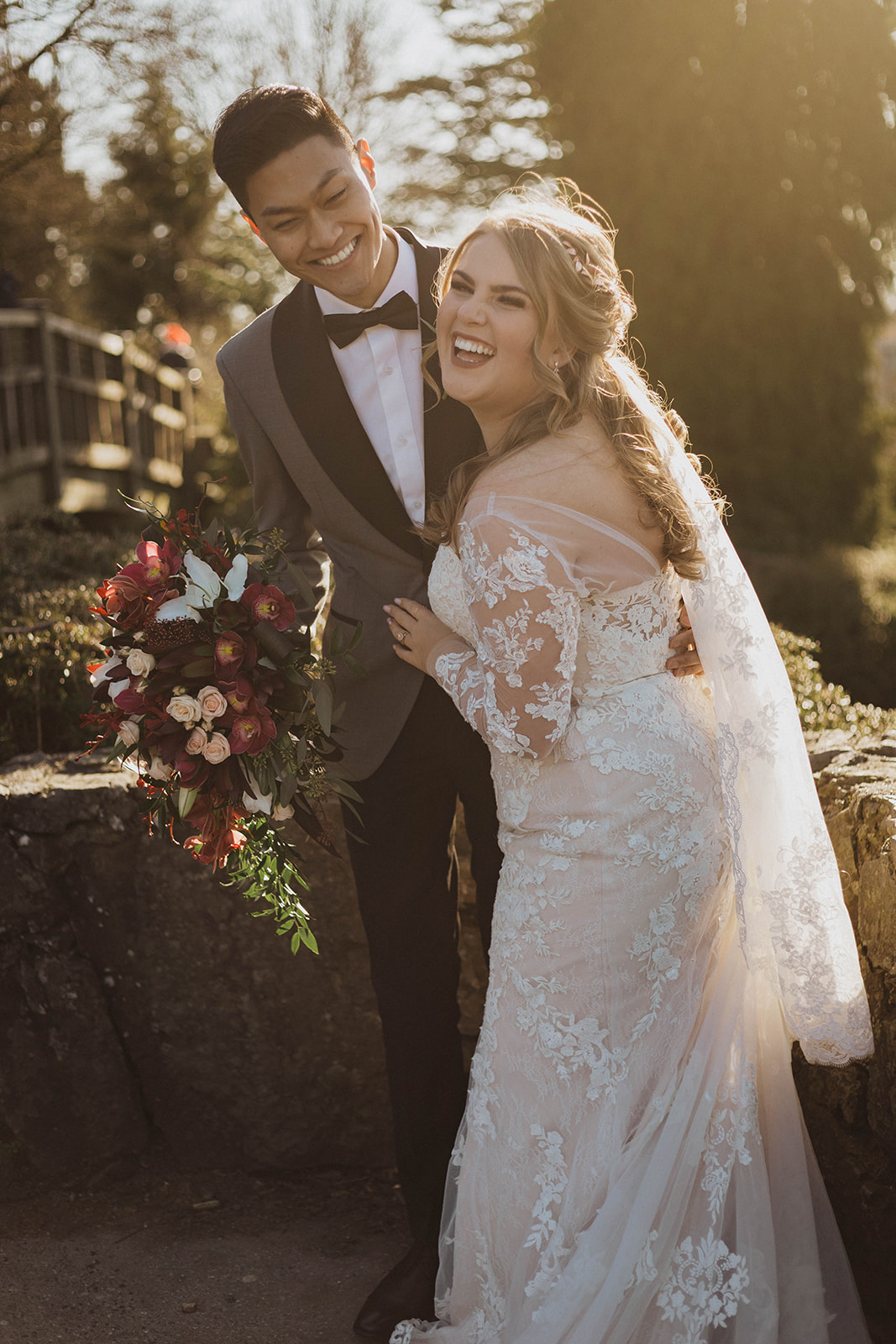 Newlyweds laughing as they take photos after ceremony in Vancouver by Kacie McColm