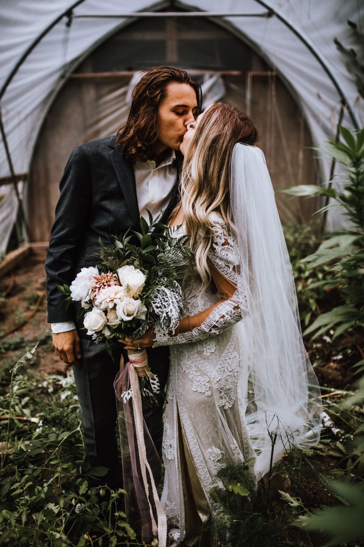 Newlyweds kiss by Wild Oak Collective