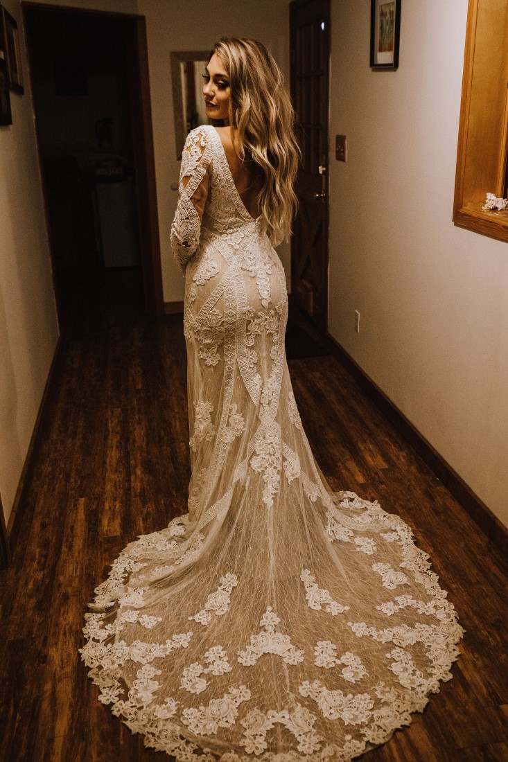 Bride in gorgeous lace gown with short trainby Willowby and Watters from Shades of White