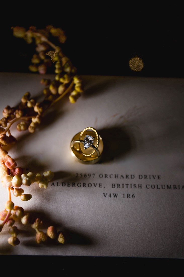 Rings by Cavalier Gastown Vancouver sit on invitation by Paper Poet