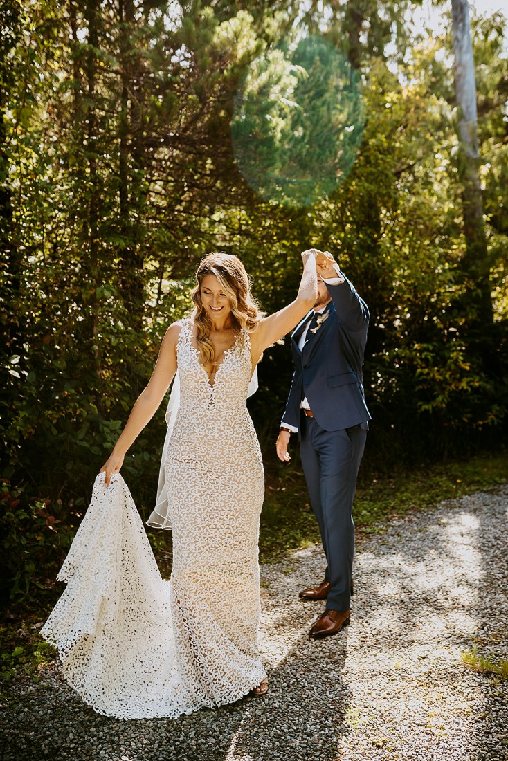 Groom twirls his bride on Tofino path