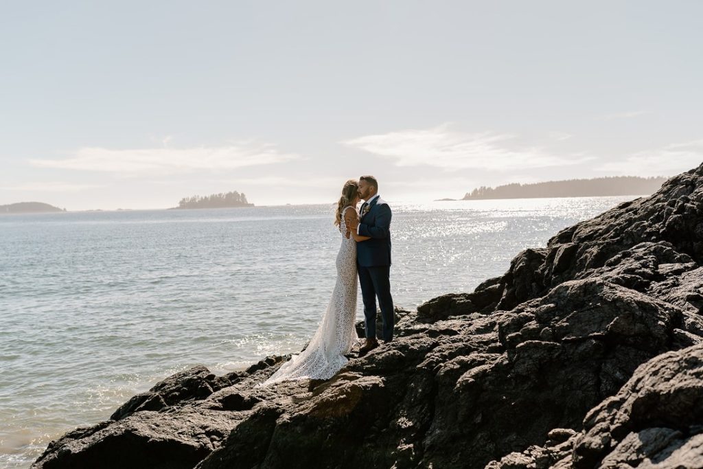 Beach Wed in Tofino newlyweds with ocean behind them