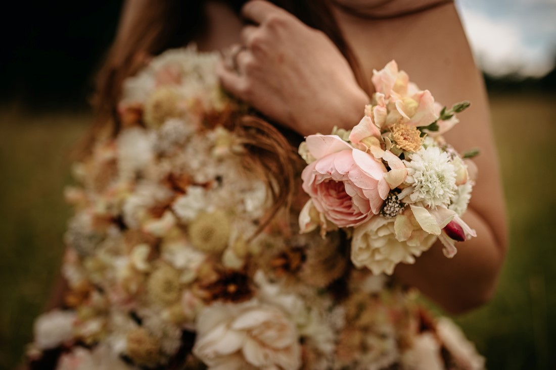 Bride wears flowers on entire body by Karen Bezaire