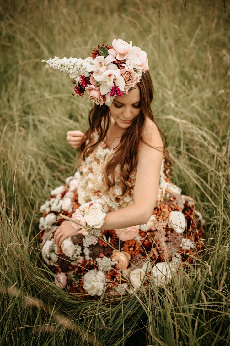 Bride wears flowers and head wreath by Karen Bezaire