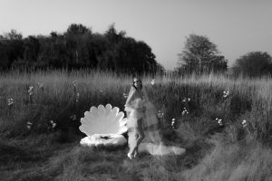 Aisle Style Bride in long veil with shell behind her by Meghan Hemstra in Jan Rhyan Vancouver