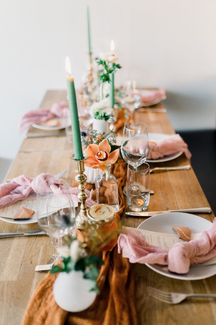 Reception table with tall candles at Fiore and Famiglia Vancouver