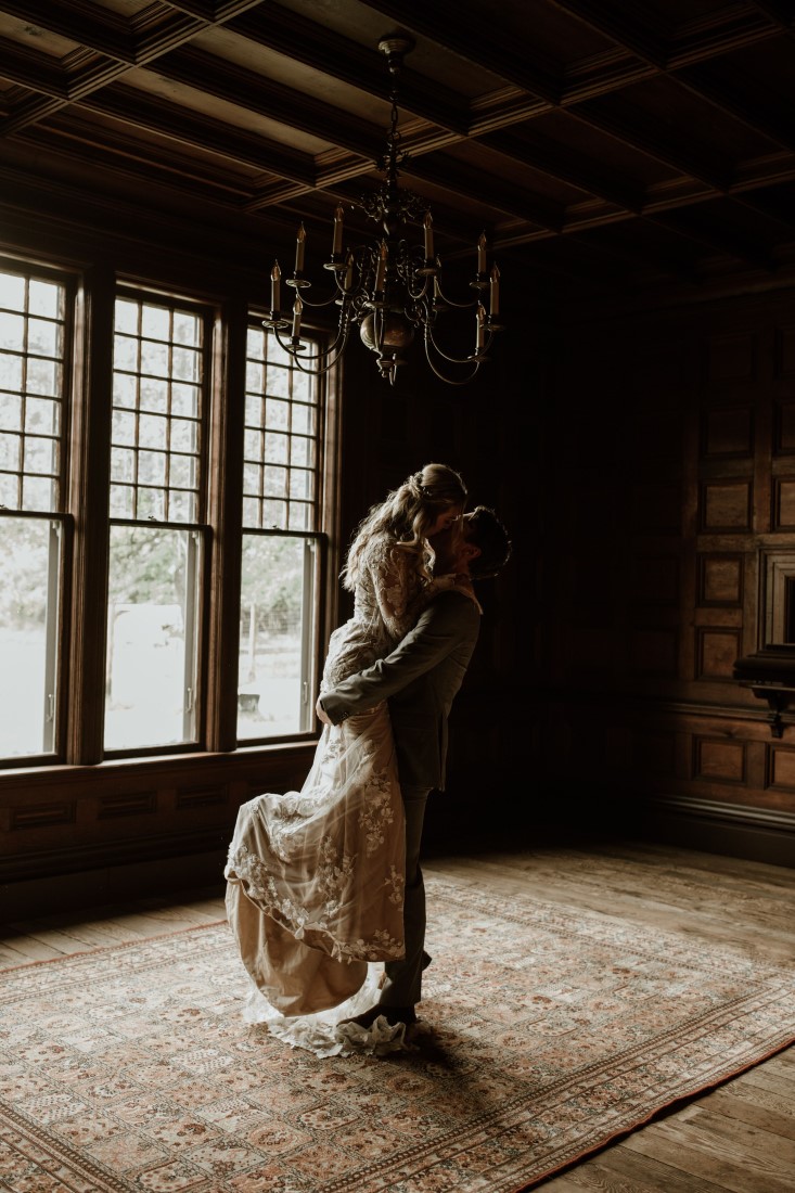 Groom lifts bride in a hug at Keating Farm by Secret Waters Photo