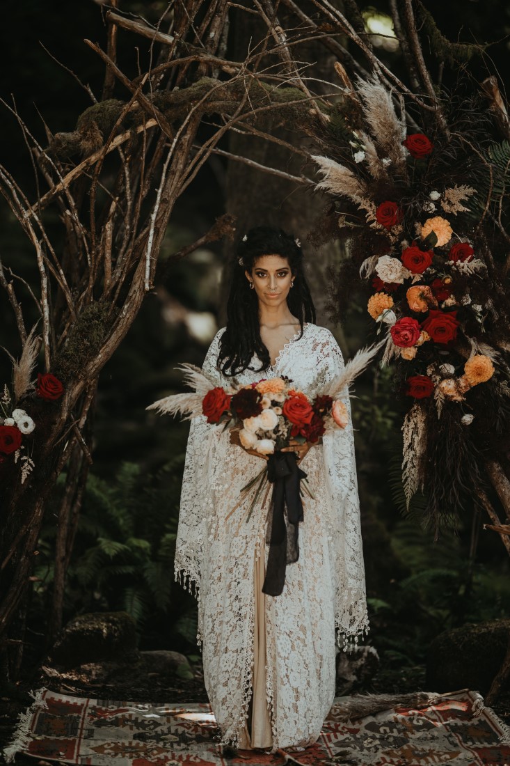 Bride in forest holding dahlia bouquet by Platinum Floral Vancouver Island