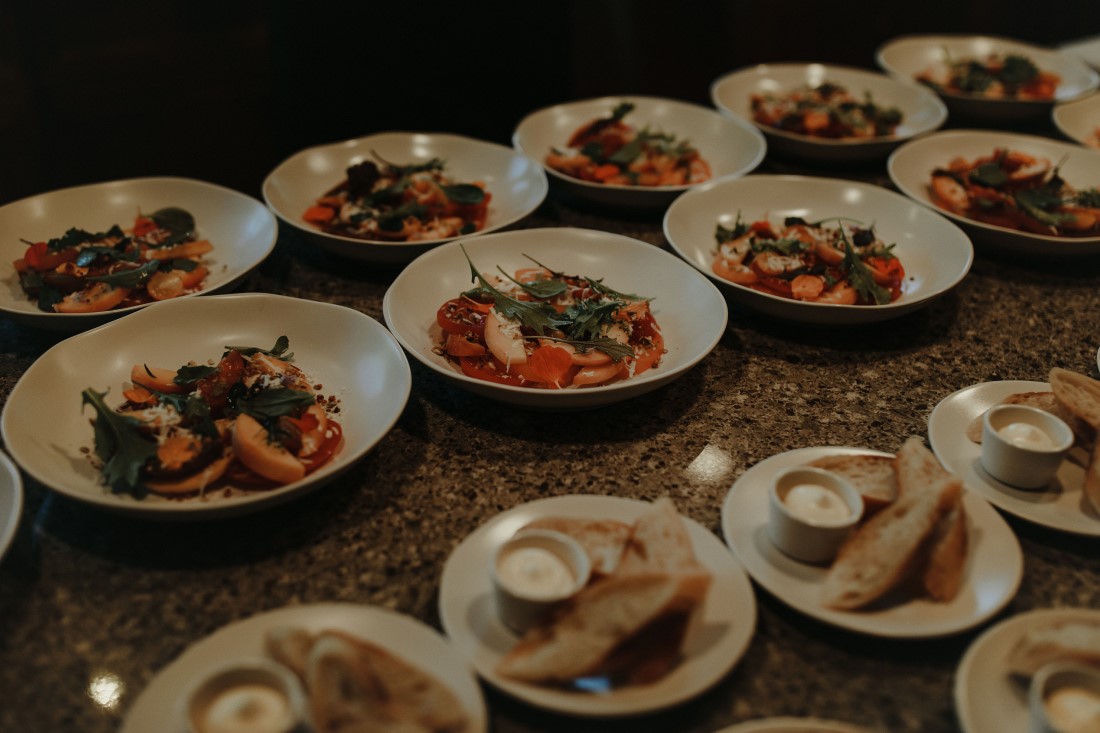 Backyard Bliss wedding dishes filled with Salt and Earth Catering Co. cuisine in Vancouver