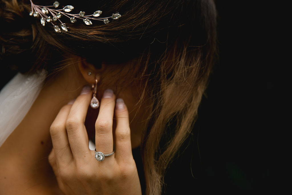 Brides hand with engagement and wedding ring