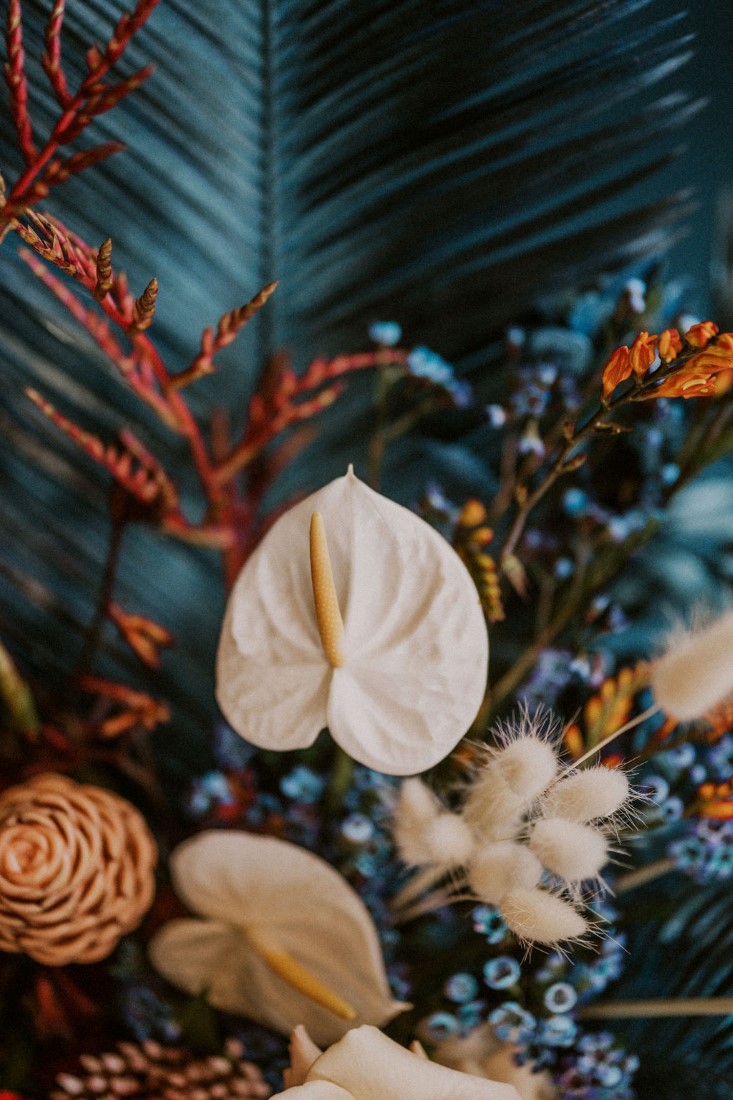White calla lily with blue and orange floral design