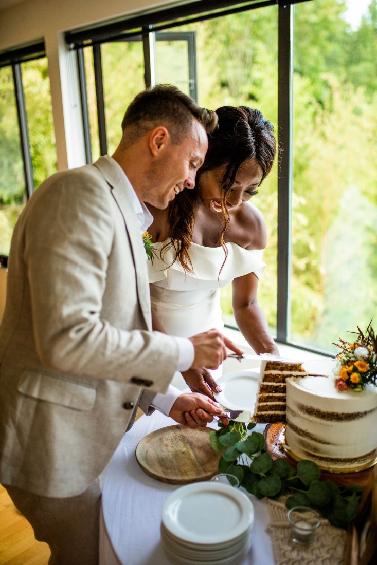 Newlyweds cut cake at Vancouver virtual weddinggggggggggggggggggggggggg