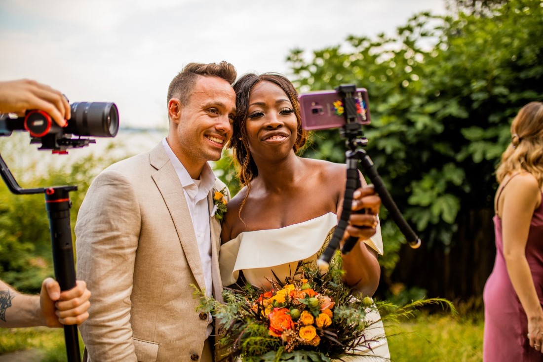 Newlyweds talk to guests over Zoom camera in Vancouver