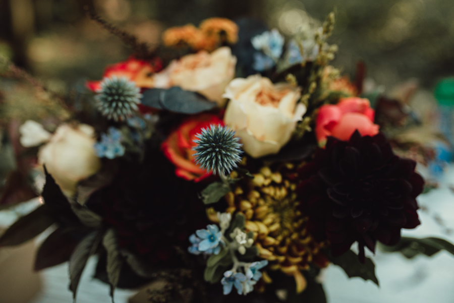 Bridal bouquet with blue thistles by Niche Boutique Floral