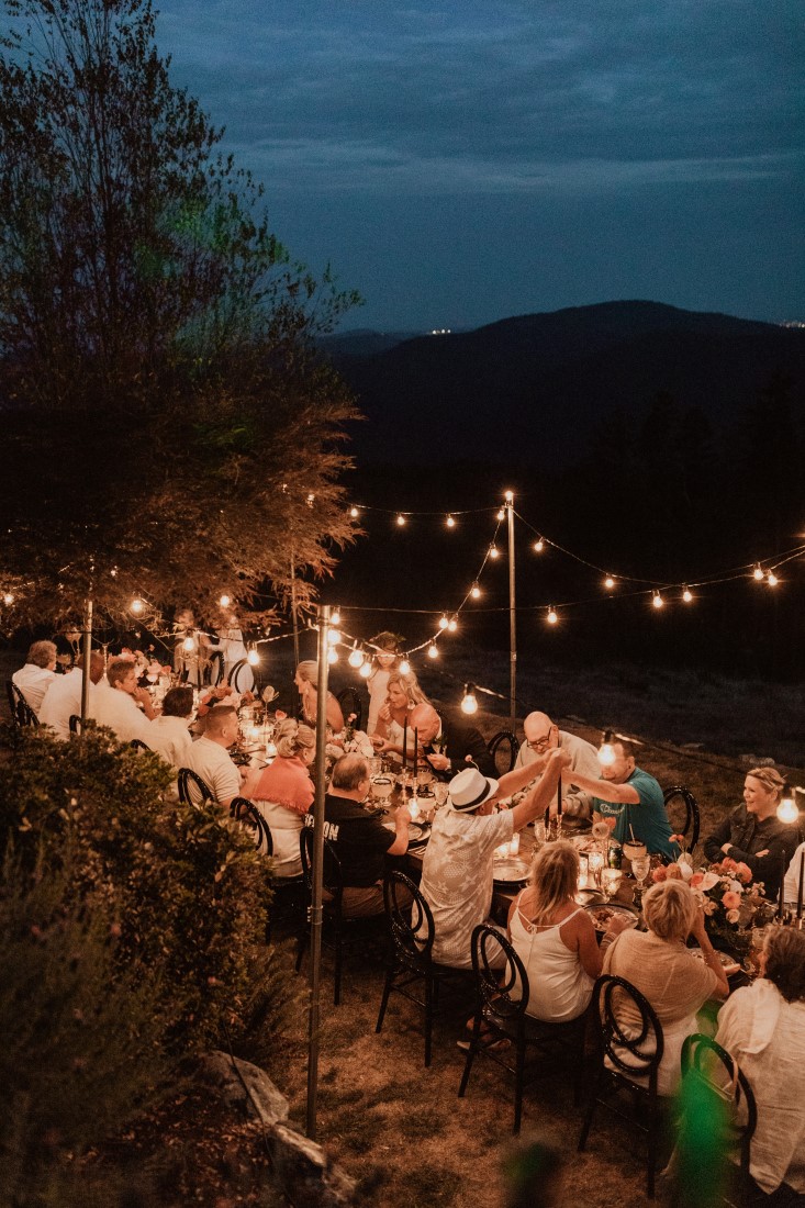Cafe lights above the wedding arm table 