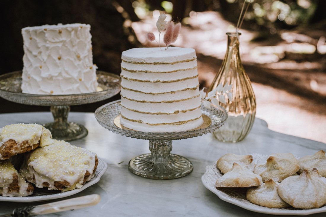 White layered wedding cakes and scones dusted with sugar 