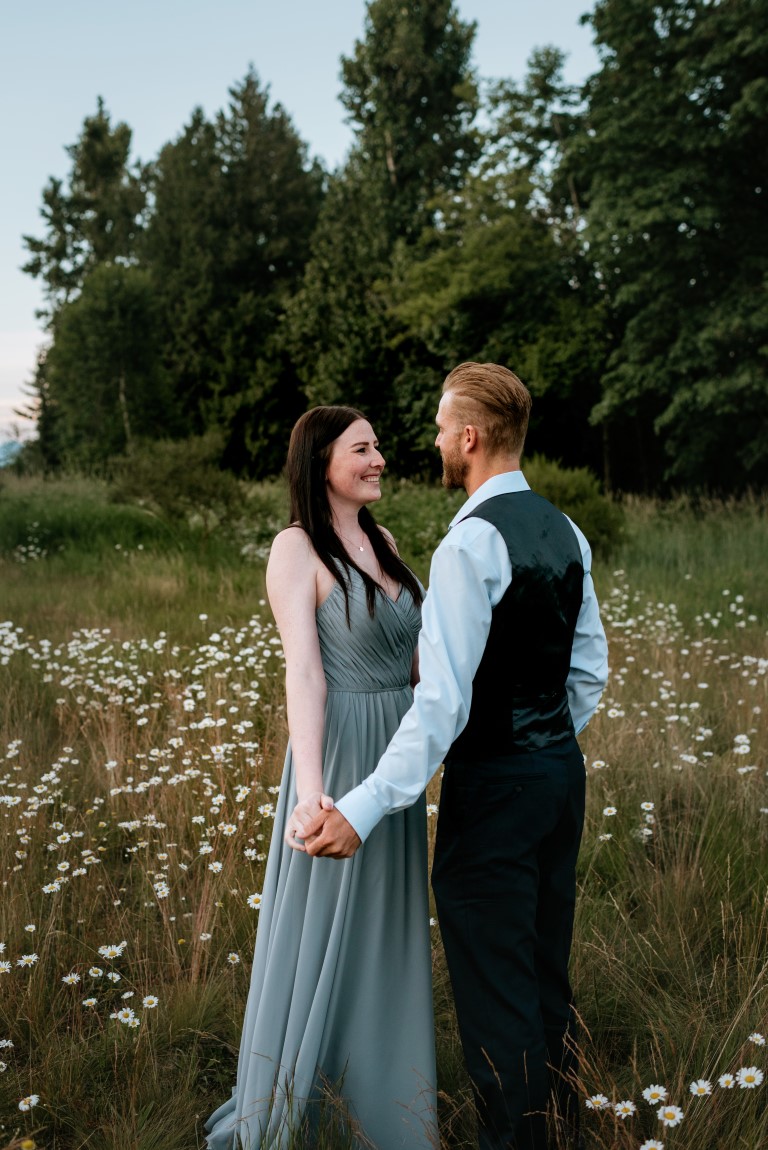 Bride wears grey La Chateau gown and groom wears vest