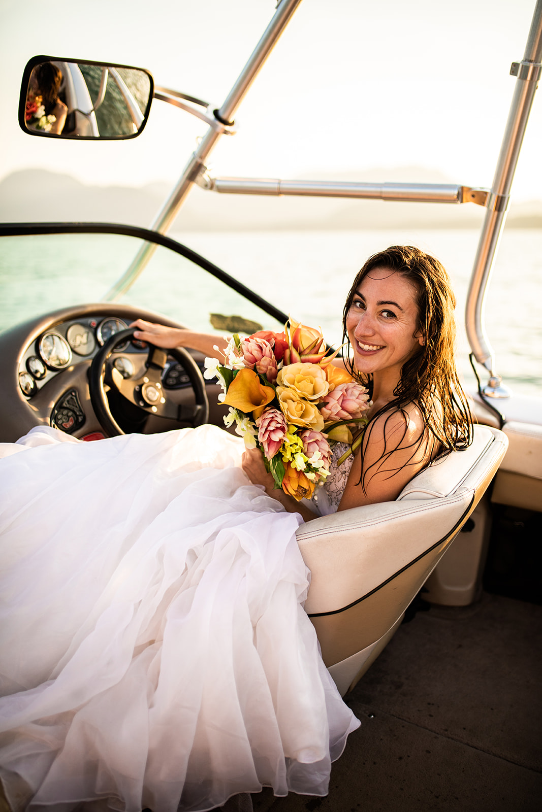 Surfer Bride Smiles holding bouquet 