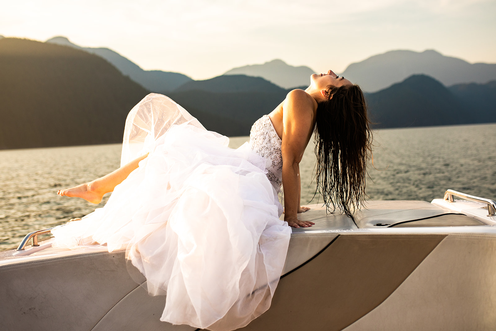 Bride poses in front of Vancouver mountain and lakes