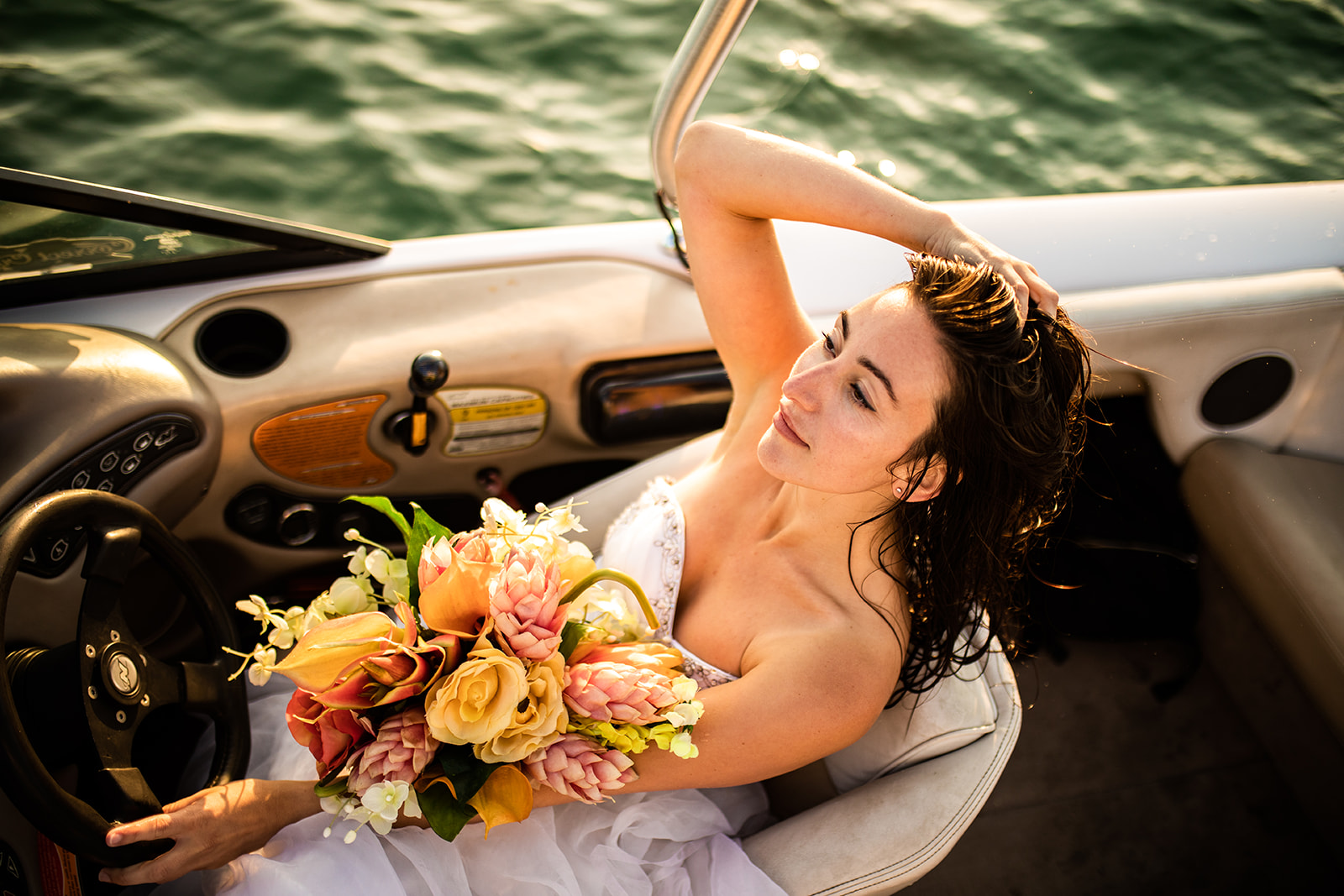 Bride sits in boat driver seat in Vancouver