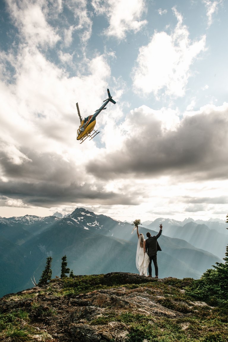 Couple waves to helicopter after I dos