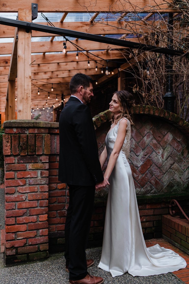 Ocean + Ink Victoria Elopement couple exchange vows in brick alley