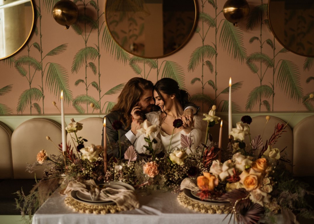 Dreamy embrace pink and palms surrounded by floral design