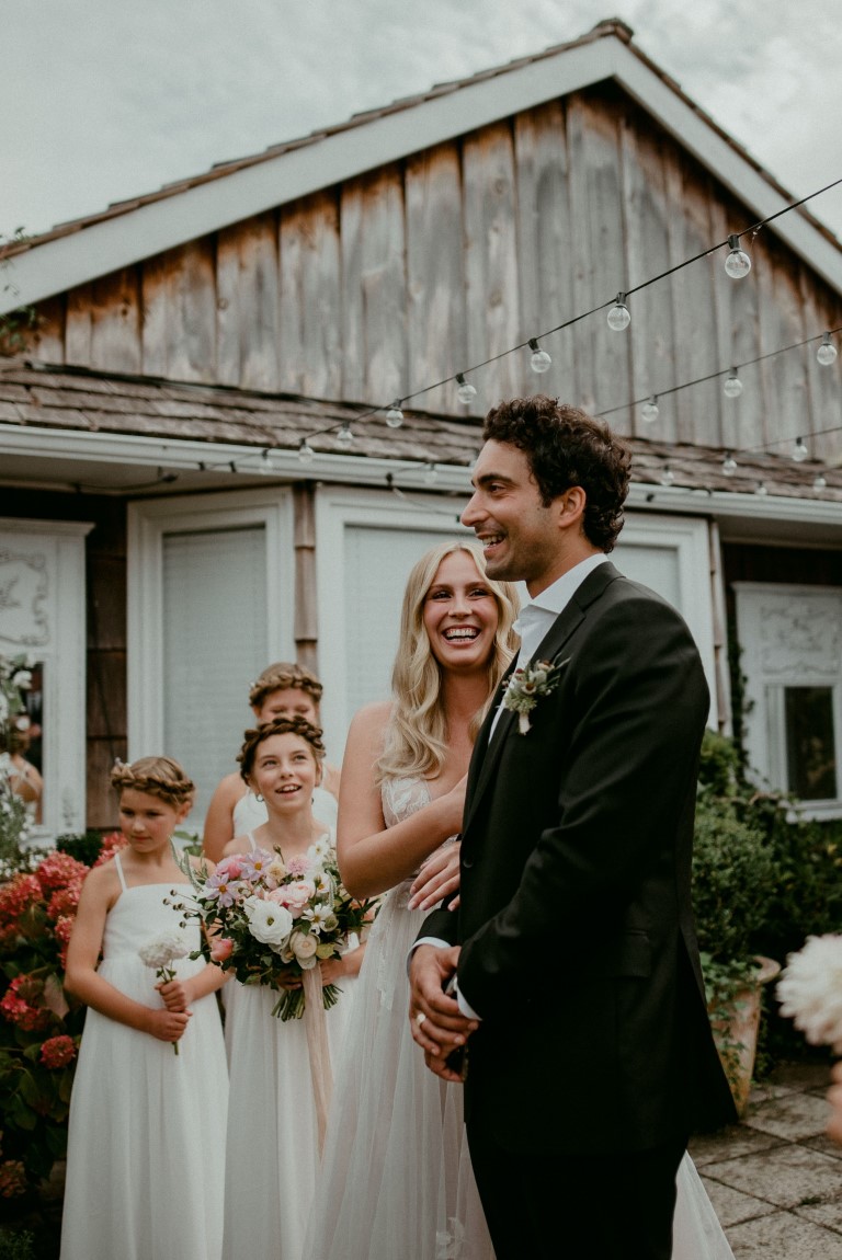 Bride smiles at groom during wedding vows on Vancouver Island