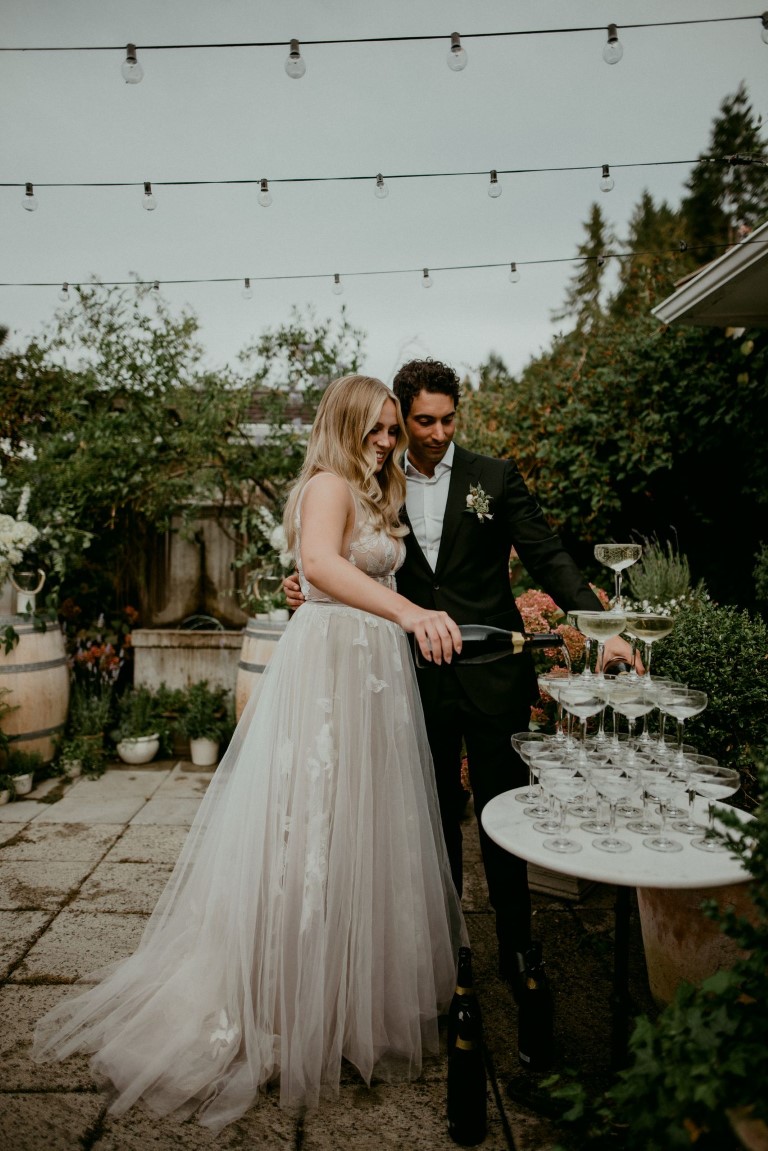 Newlyweds on Vancouver Island pour champagne tower