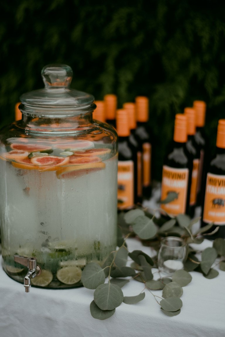 West Coast Wild wedding celebration wine bottles and oranges
