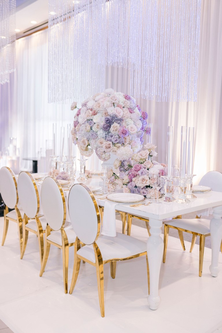 Pastel floral arrangements on white table at Luxe Wedding Show Vancouver