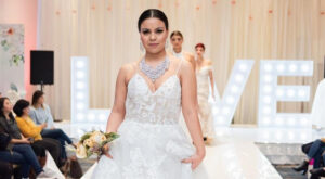 bride in white strapless gown walks down runway at Swank Show Vancouver