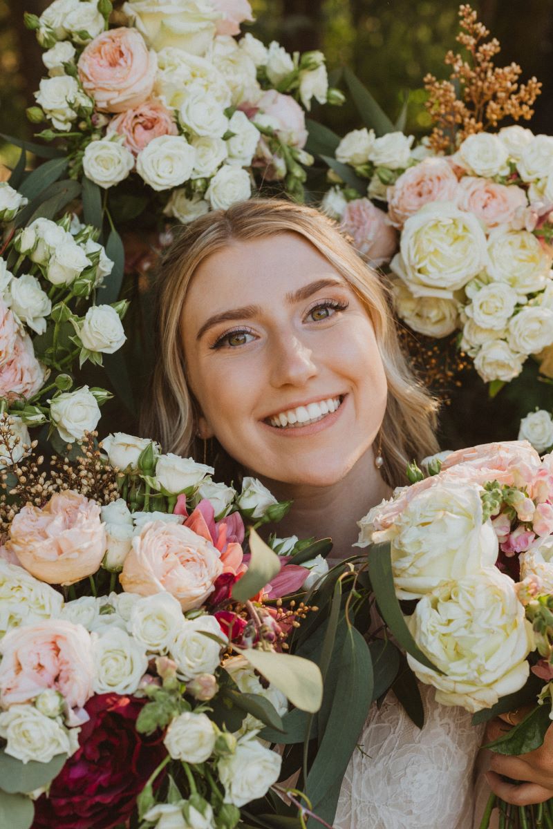 bride surrounded by bouquets by West Coast Floral Design Vancouver Island