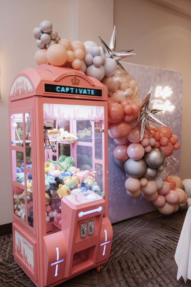 Pink cl;aw machine at West Coast Wedding Show Vancouver