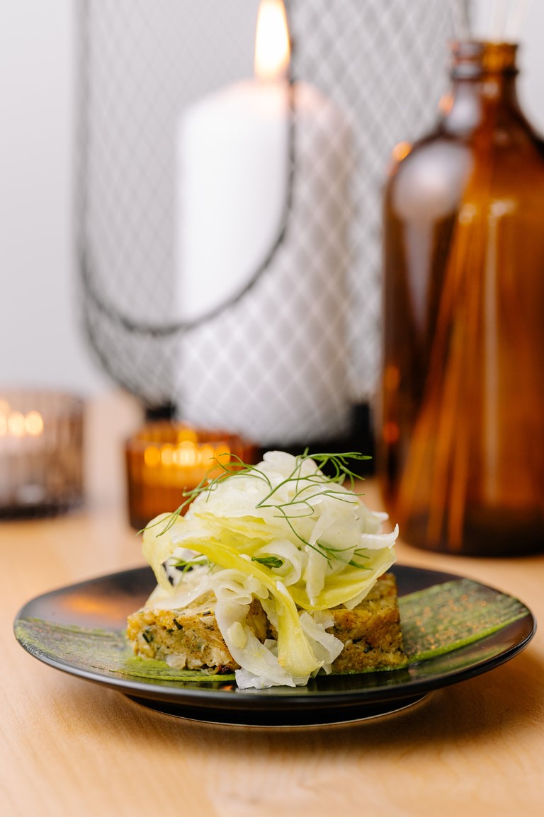 Plated appetizer and wine glass