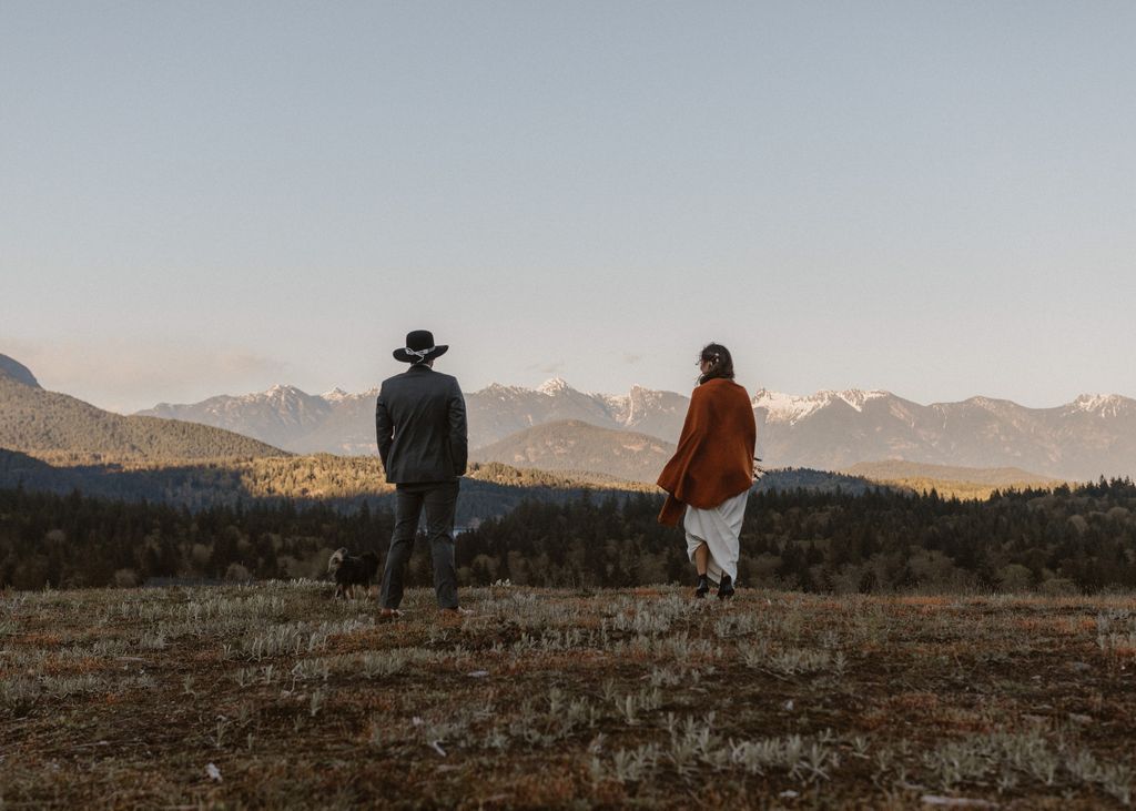 Indigenous newlyweds walk out into field