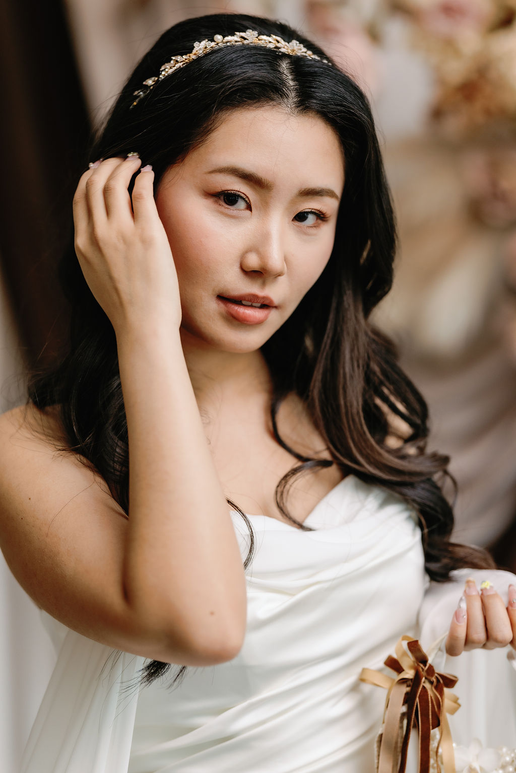 Bride looks at camera by SoWedding