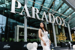 bride in front of the iconic Paradox Vancouver Hotel